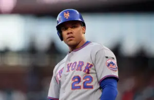 New York Mets outfielder Juan Soto (22) reacts after scoring a run.