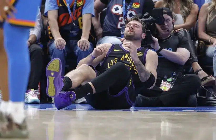 Los Angeles Lakers guard Luka Doncic (77) falls to the court during a play.