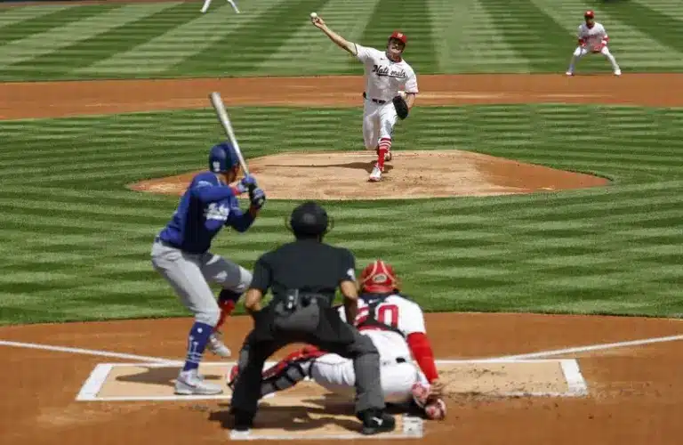 Washington Nationals pitcher Miles Mikolas (36) pitches against Los Angeles Dodgers shortstop Mookie Betts (50).
