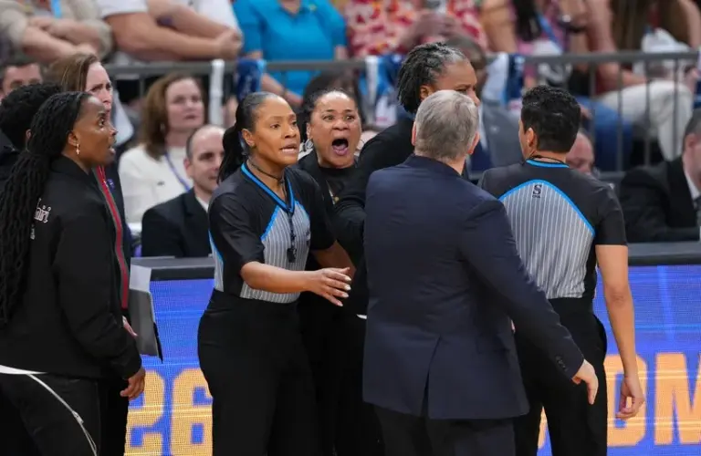 UConn Huskies head coach Geno Auriemma and South Carolina Gamecocks head coach Dawn Staley react in the second half.