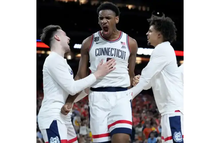 UConn Huskies celebrating on the court