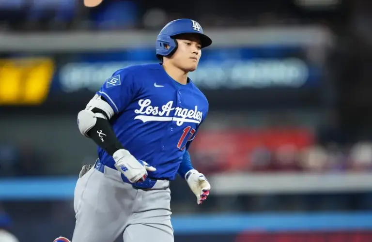 Los Angeles Dodgers designated hitter Shohei Ohtani (17) runs the bases after hitting a home run.