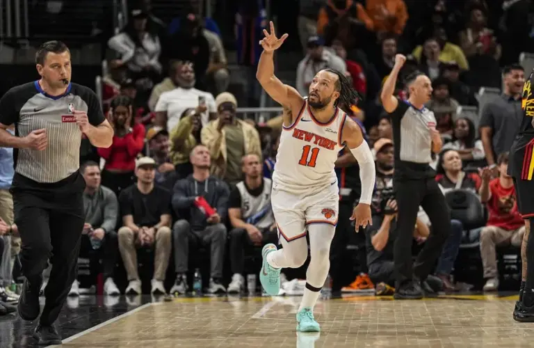 New York Knicks guard Jalen Brunson (11) reacts after making a three point shot.