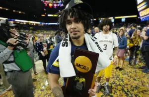 Michigan Wolverines guard Elliot Cadeau (3) celebrates after their win against the UConn Huskies.
