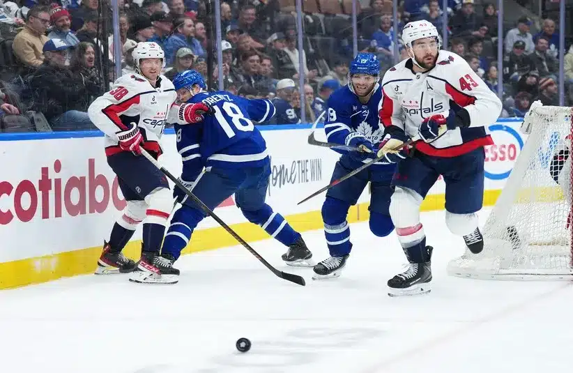 Toronto Maple Leafs center Calle Jarnkrok (19) battles with Washington Capitals right wing Tom Wilson (43).