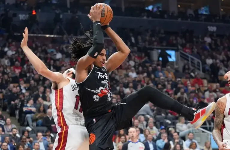 Toronto Raptors forward Collin Murray-Boyles (12) rebounds the ball.