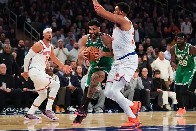 Apr 9, 2026; New York, New York, USA; Boston Celtics forward Jayson Tatum (0) drives on New York Knicks center Karl-Anthony Towns (32) during the fourth quarter at Madison Square Garden.