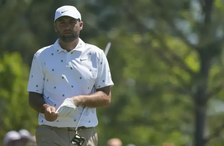 Scottie Scheffler walks the third green.