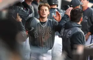 New York Mets left fielder Carson Benge (3) celebrates in the dugout.