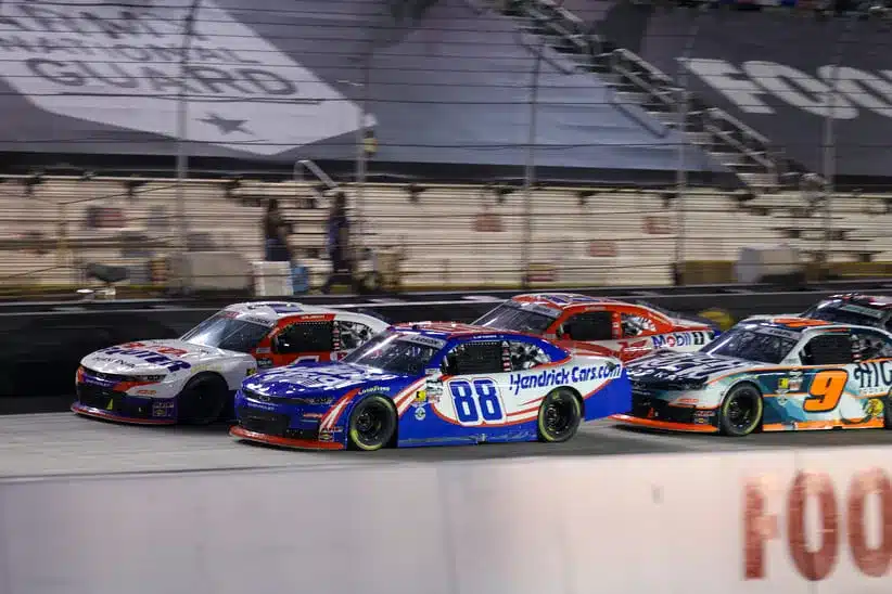 NASCAR; Apr 11, 2026; Bristol, Tennessee, USA; JR Motorsports driver Connor Zilisch (1) and JR Motorsports driver Kyle Larson (88) lead a restart at Bristol Motor Speedway.