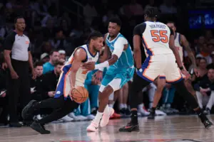 Apr 12, 2026; New York, New York, USA; New York Knicks guard Miles McBride (2) is guarded by Charlotte Hornets forward Brandon Miller (24) during the first half at Madison Square Garden. Mandatory Credit: Vincent Carchietta-Imagn Images