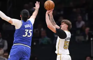 Boston Celtics guard Baylor Scheierman (55) shoots.
