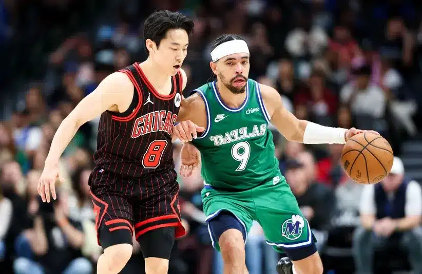 Dallas Mavericks guard Ryan Nembhard (9) dribbles.