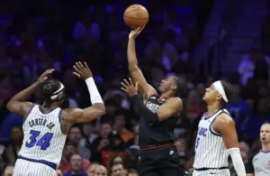 Philadelphia 76ers guard Tyrese Maxey (0) drives for a shot.