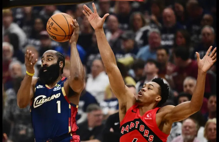Cleveland Cavaliers guard James Harden (1) looks to pass as Toronto Raptors forward Scottie Barnes (4) defends during the first quarter of game one in the first round of the 2026 NBA Playoffs at Rocket Arena.