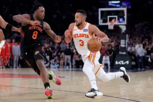 Apr 20, 2026; New York, New York, USA; Atlanta Hawks guard CJ McCollum (3) drives to the basket against New York Knicks forward OG Anunoby (8) during the fourth quarter of game two of the first round of the 2026 NBA Playoffs at Madison Square Garden.