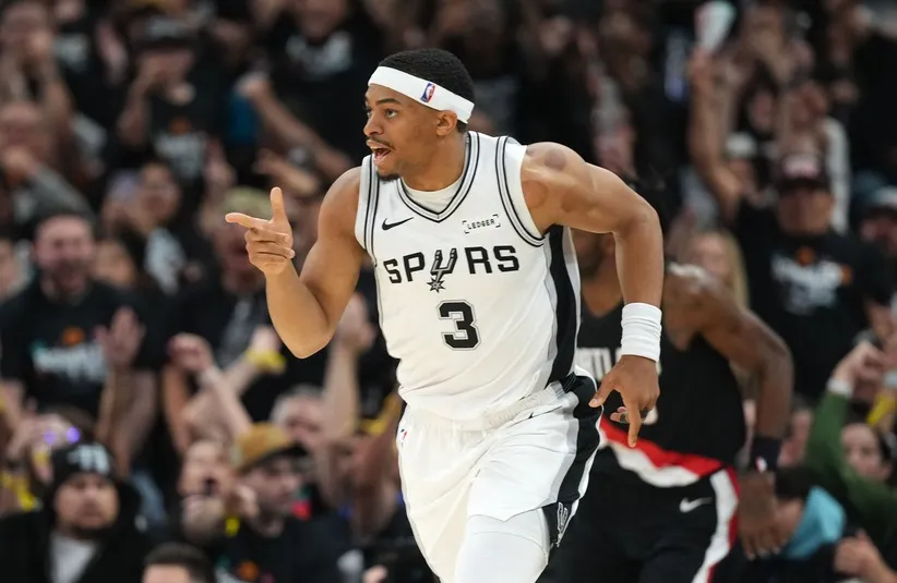 San Antonio Spurs forward Keldon Johnson (3) reacts after scoring.