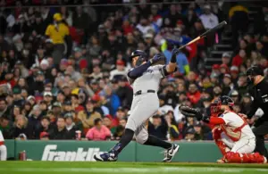 New York Yankees right fielder Aaron Judge (99) hits a single.