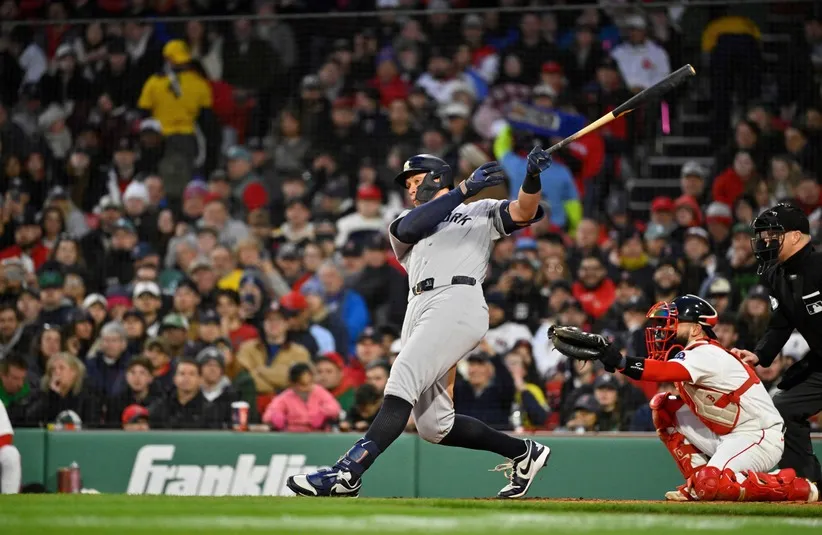 New York Yankees right fielder Aaron Judge (99) hits a single.