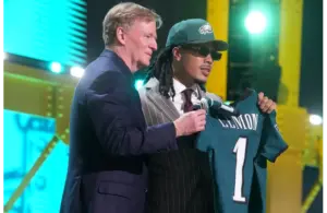 Makai Lemon with Roger Goodell holding up his new Philadelphia Eagles jersey