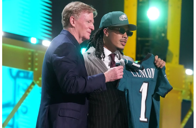 Makai Lemon with Roger Goodell holding up his new Philadelphia Eagles jersey