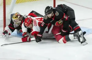 Carolina Hurricanes left wing William Carrier (28) is taken down as he battles with Ottawa Senators defenseman Cameron Crotty (5).