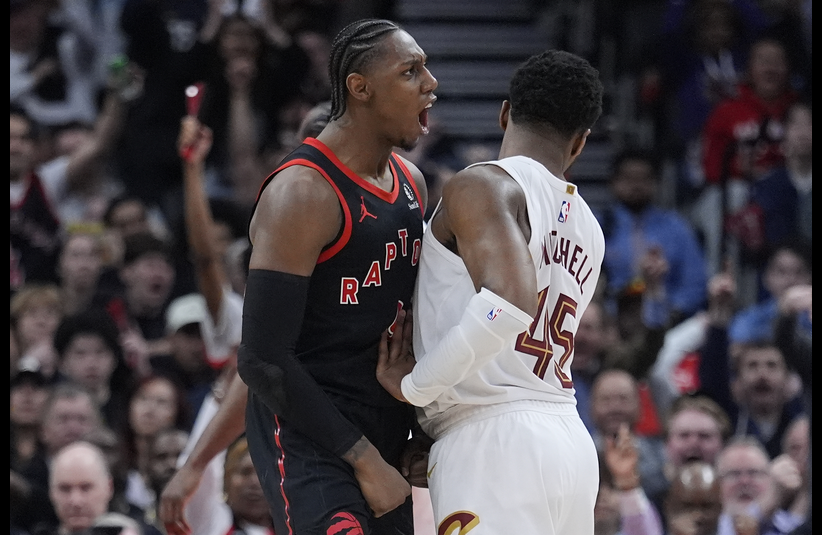 Toronto Raptors forward RJ Barrett (9) celebrates as Cleveland Cavaliers guard Donovan Mitchell (45) tries to walk away during the second half of game three of the first round of the 2026 NBA Playoffs at Scotiabank Arena.