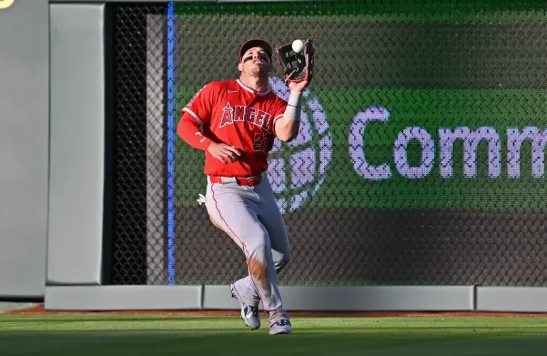 Los Angeles Angels center fielder Mike Trout (27) catches a fly ball.
