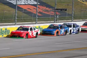 Apr 25, 2026; Talladega, Alabama, USA; O'Reilly Auto Parts Series driver Jesse Love (2) leads against O'Reilly Auto Parts Series driver Ryan Sieg (39) and O'Reilly Auto Parts Series driver Blaine Perkins (31) during the AG-Pro 300 NASCAR O'Reilly Auto Parts Series race at Talladega Superspeedway.