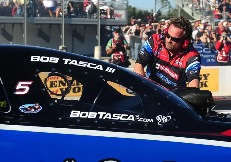 Mar. 12, 2011; Gainesville, FL, USA; NHRA crew chief Chris Cunningham guides funny car driver Bob Tasca III during qualifying for the Gatornationals at Gainesville Raceway.