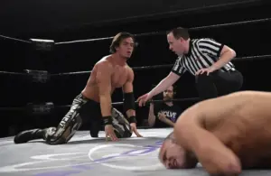 Darby Allin competes in the ring against Austin Theory.