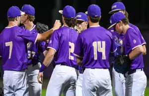 James Madison Baseball team huddles together following loss.