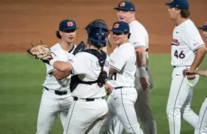 Auburn Tigers' Jackson Sanders (36) and Chase Fralick (3) celebrate victory as Auburn Tigers take on LSU Tigers during the SEC baseball tournament at Hoover Metropolitan Stadium in Hoover, Ala. on Wednesday, May 20, 2026. Auburn Tigers defeated LSU Tigers 3-1.