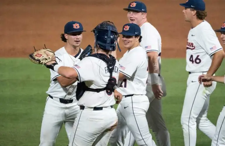 Auburn Tigers' Jackson Sanders (36) and Chase Fralick (3) celebrate victory as Auburn Tigers take on LSU Tigers during the SEC baseball tournament at Hoover Metropolitan Stadium in Hoover, Ala. on Wednesday, May 20, 2026. Auburn Tigers defeated LSU Tigers 3-1.