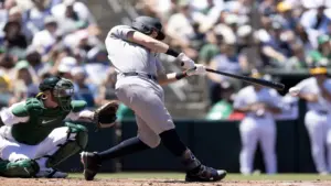 May 31, 2026; West Sacramento, California, USA; New York Yankees designated hitter Ben Rice (22) connects for a two-run double against the Athletics during the third inning at Sutter Health Park.