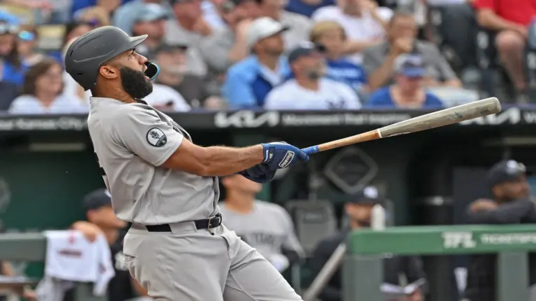 May 26, 2026; Kansas City, Missouri, USA; New York Yankees third baseman Amed Rosario (14) hits a two-run home run in the first inning against the Kansas City Royals at Kauffman Stadium.