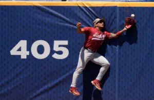 May 21, 2025; Hoover, AL, USA; Alabama centerfielder Richie Bonomolo Jr. (5) makes a leaping catch against the centerfield fence during the game with Tennessee in the second round of the SEC Baseball Tournament at the Hoover Met.