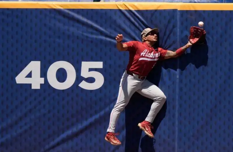 May 21, 2025; Hoover, AL, USA; Alabama centerfielder Richie Bonomolo Jr. (5) makes a leaping catch against the centerfield fence during the game with Tennessee in the second round of the SEC Baseball Tournament at the Hoover Met.