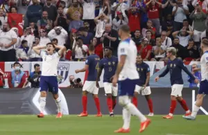 England defender Harry Maguire (6) reacts after a play during the second half of a quarterfinal game against France in the 2022 FIFA World Cup.