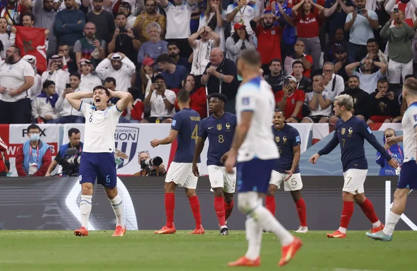 England defender Harry Maguire (6) reacts after a play during the second half of a quarterfinal game against France in the 2022 FIFA World Cup.