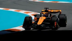 McLaren driver Oscar Piastri (81) races into turn three during F1 practice at Miami International Autodrome.