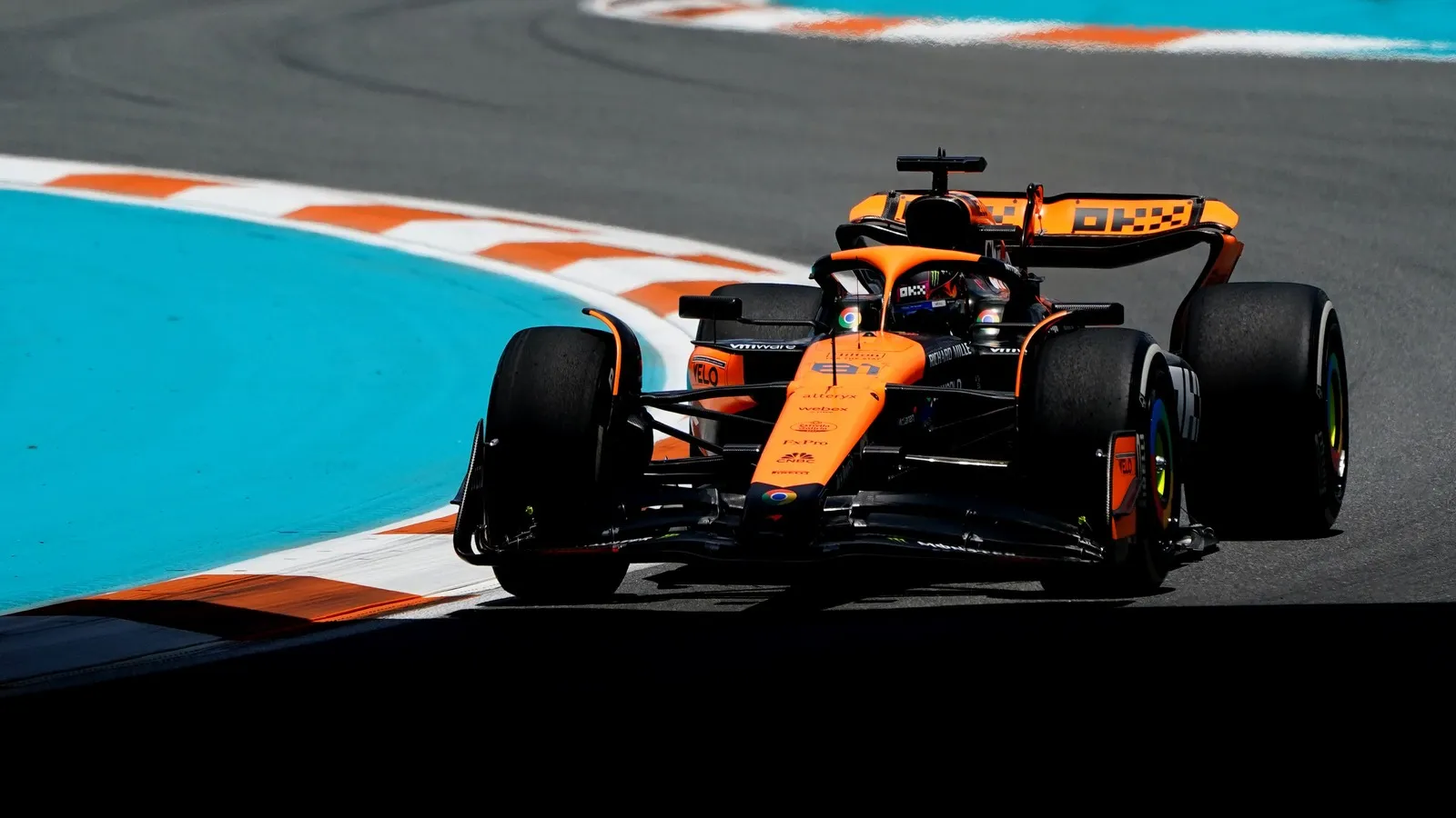 McLaren driver Oscar Piastri (81) races into turn three during F1 practice at Miami International Autodrome.