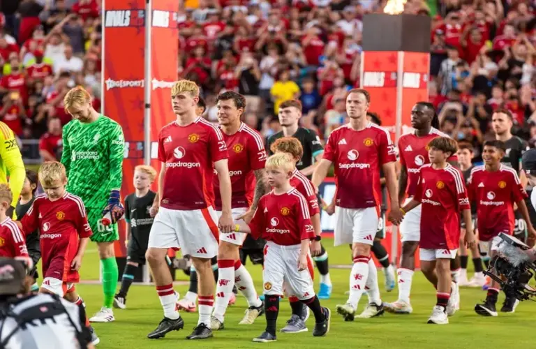 Liverpool players enter the field before their match