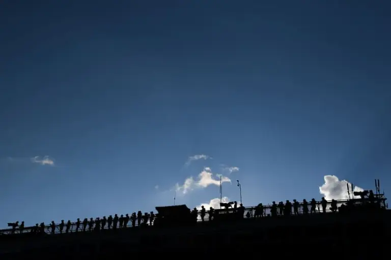 Sep 15, 2024; Watkins Glen, New York, USA; Team crew members look from the top of the main press box during the Go Bowling at The Glen at Watkins Glen International.
