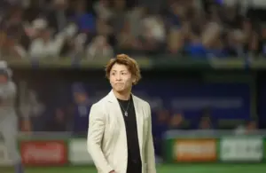 Professional Boxer Naoya Inoue walks onto the mound before throwing a ceremonial first pitch.