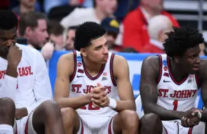 St. John's Red Storm guard RJ Luis Jr. (12), guard Kadary Richmond (1) and teammates on the bench.