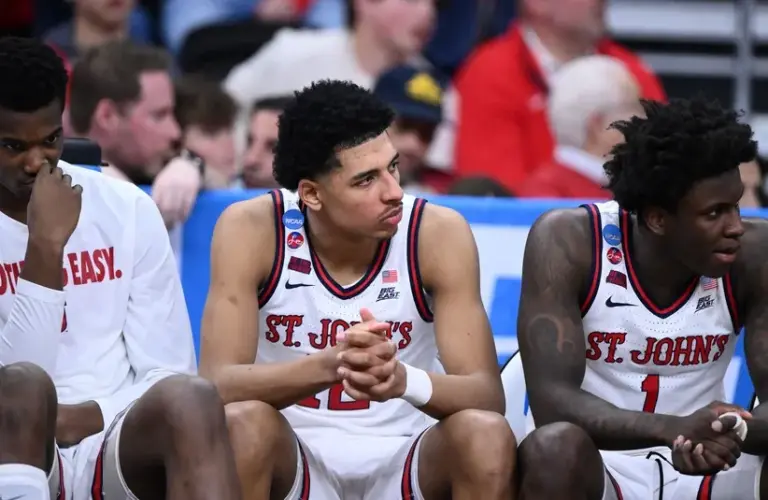 St. John's Red Storm guard RJ Luis Jr. (12), guard Kadary Richmond (1) and teammates on the bench.