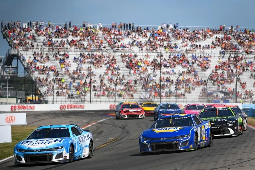 Aug 10, 2025; Watkins Glen, New York, USA; NASCAR Cup Series driver Ross Chastain (1) leads a group of cars during the Go Bowling at The Glen at Watkins Glen International.