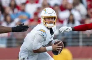 Los Angeles Chargers quarterback Taylor Heinicke (4) runs with the football.