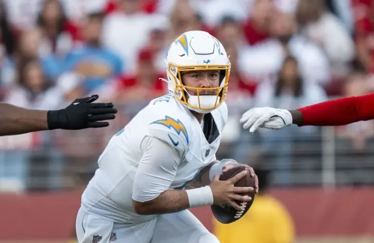 Los Angeles Chargers quarterback Taylor Heinicke (4) runs with the football.